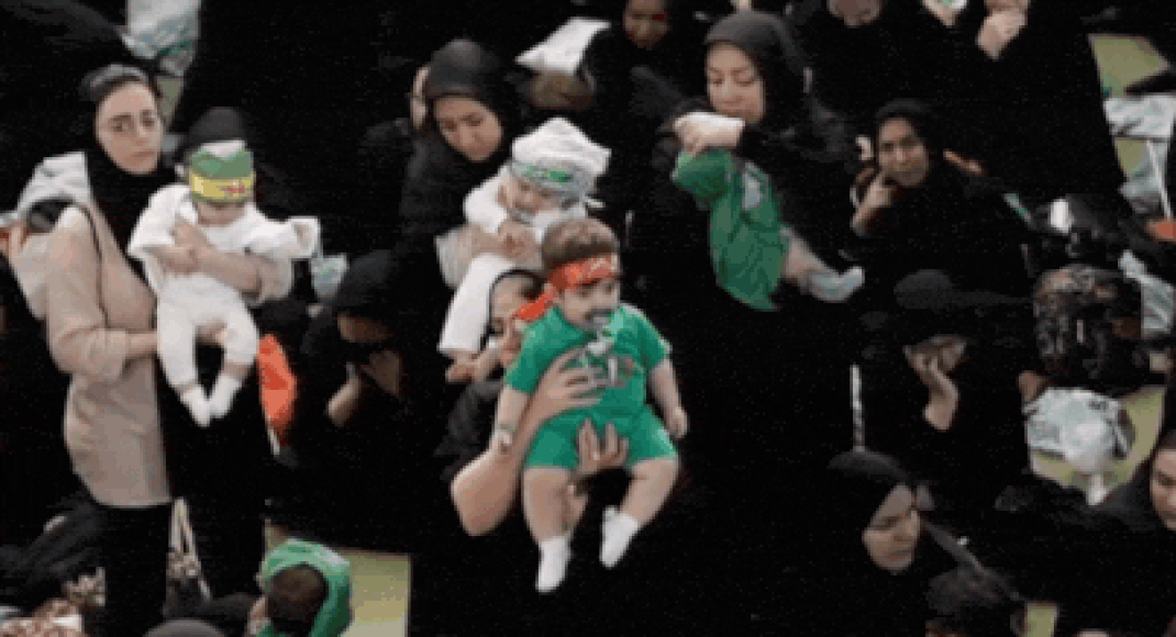 Hosseini infants ceremony: In war’s shadow, hundreds of Iranian mothers offer babies as martyrs – video