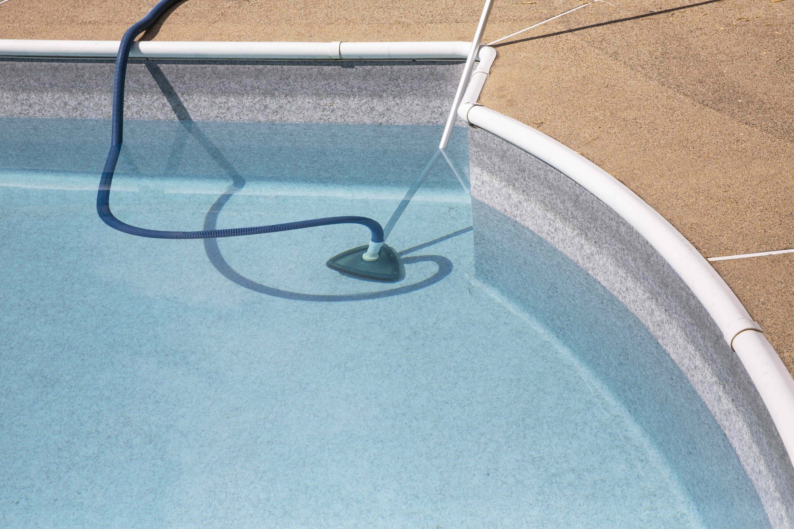 4 Ways to Get Sand and Dirt Out of Your Pool Fast, According to Pool Pros