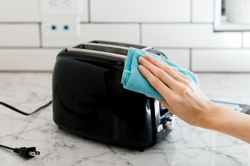 We Asked a Cleaning Pro How to Clean Greasy Kitchen Appliances, and It’s So Simple