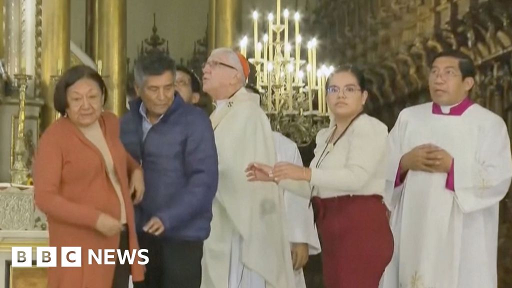 People run away from the church because the earthquake disrupts mass in Peru