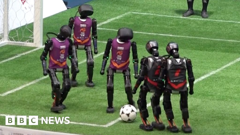 Humanoid robots stumble through football matches in China