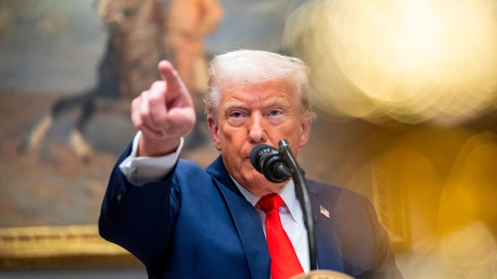 Rush of Trump orders resurrects travel ban and targets Biden