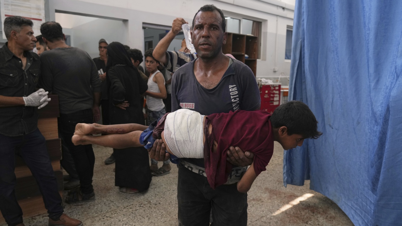 74 dead in Gaza as Israel strikes a cafe, shoots aid seekers : NPR